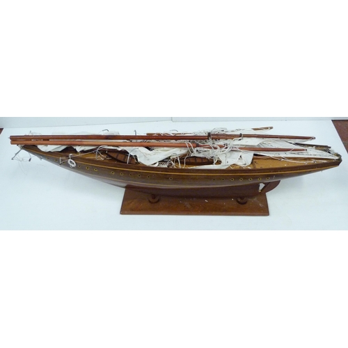 343 - Large scratch-built wooden pond yacht with masts, small boats to the deck, fixed to a plinth stand, ... 