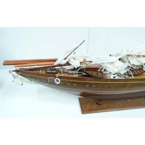 343 - Large scratch-built wooden pond yacht with masts, small boats to the deck, fixed to a plinth stand, ... 