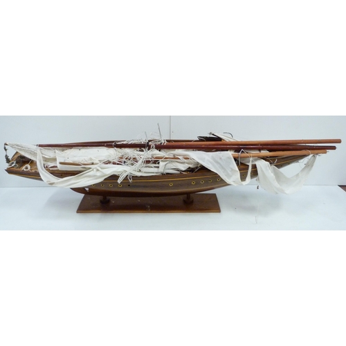 343 - Large scratch-built wooden pond yacht with masts, small boats to the deck, fixed to a plinth stand, ... 