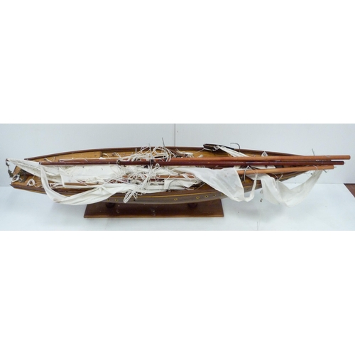 343 - Large scratch-built wooden pond yacht with masts, small boats to the deck, fixed to a plinth stand, ... 