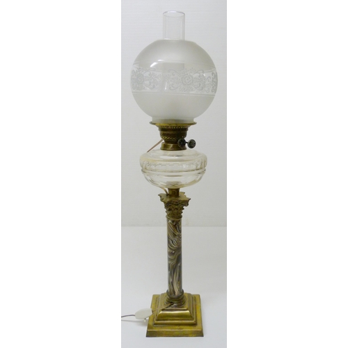 387 - British-made oil lamp, c. early 20th century, with glass reservoir above a Corinthian-type brass mou... 