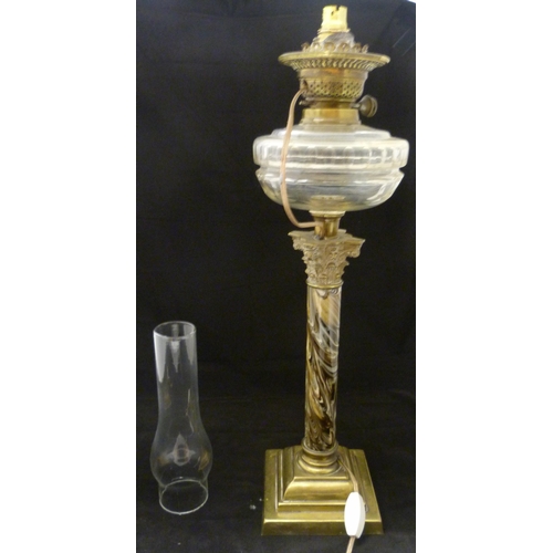 387 - British-made oil lamp, c. early 20th century, with glass reservoir above a Corinthian-type brass mou... 