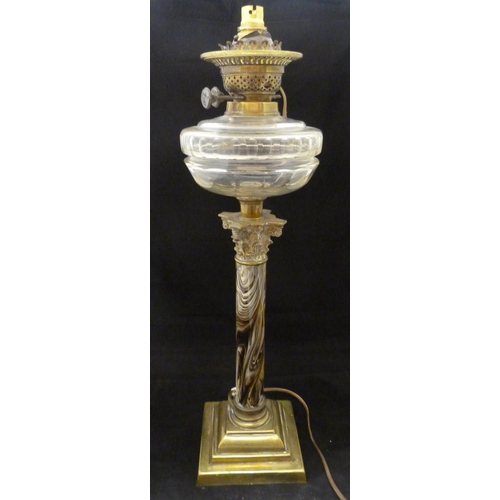 387 - British-made oil lamp, c. early 20th century, with glass reservoir above a Corinthian-type brass mou... 