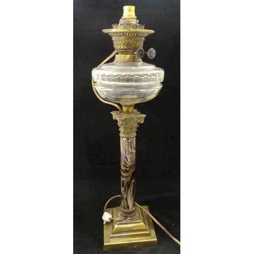 387 - British-made oil lamp, c. early 20th century, with glass reservoir above a Corinthian-type brass mou... 