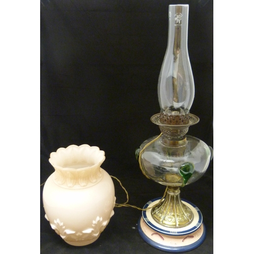 389 - Art Nouveau oil lamp, probably British made, with glass reservoir decorated with stylised green glas... 