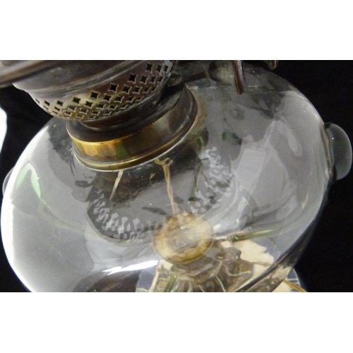 389 - Art Nouveau oil lamp, probably British made, with glass reservoir decorated with stylised green glas... 