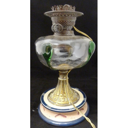 389 - Art Nouveau oil lamp, probably British made, with glass reservoir decorated with stylised green glas... 