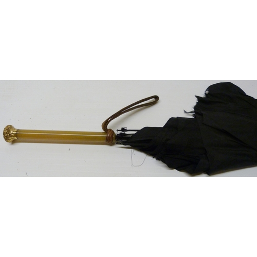 390 - Three late Victorian parasols, two examples with rolled gold collars, one with a rolled gold pommel,... 