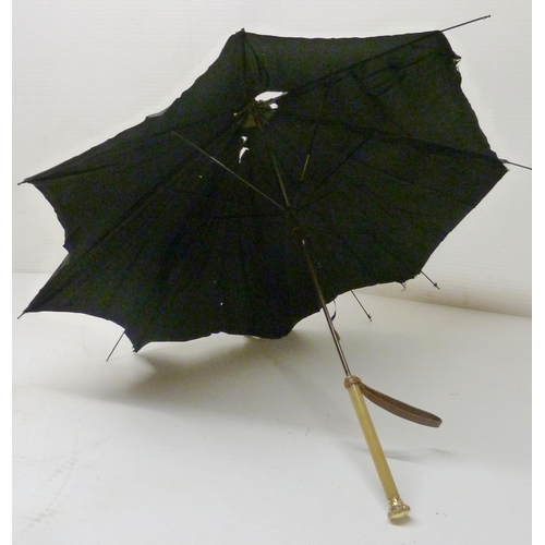 390 - Three late Victorian parasols, two examples with rolled gold collars, one with a rolled gold pommel,... 