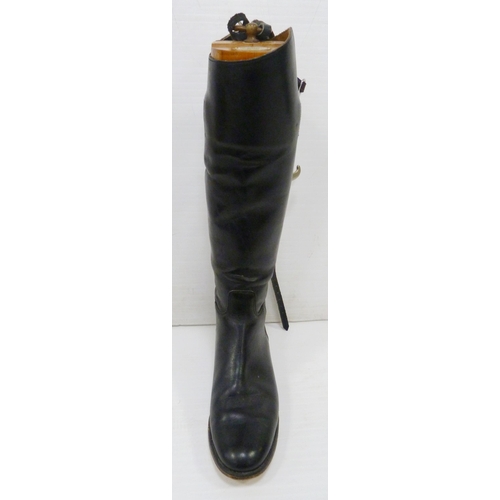 411 - Pair of black leather riding boots with wooden trees and ring pull handle, label for 'Alan McAfee, 3... 