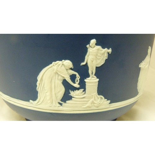 309 - Wedgwood blue Jasper ware jardinière with relief decoration of classical figures and fruiting... 