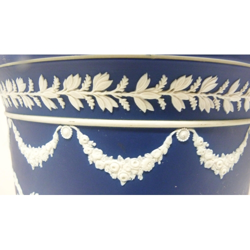 309 - Wedgwood blue Jasper ware jardinière with relief decoration of classical figures and fruiting... 