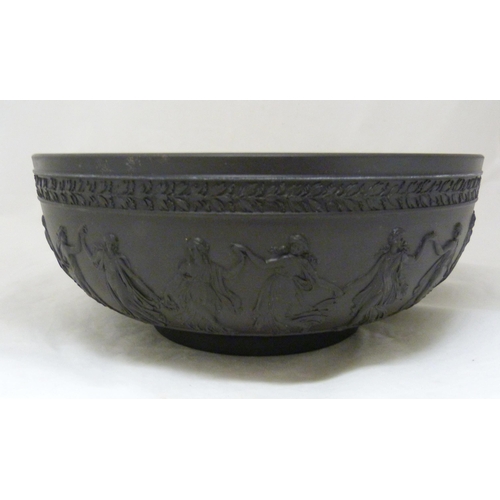 311 - Wedgwood black basalt fruit bowl with relief decoration of entwined classical figures and acanthus b... 