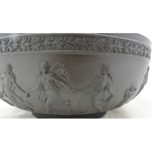 311 - Wedgwood black basalt fruit bowl with relief decoration of entwined classical figures and acanthus b... 