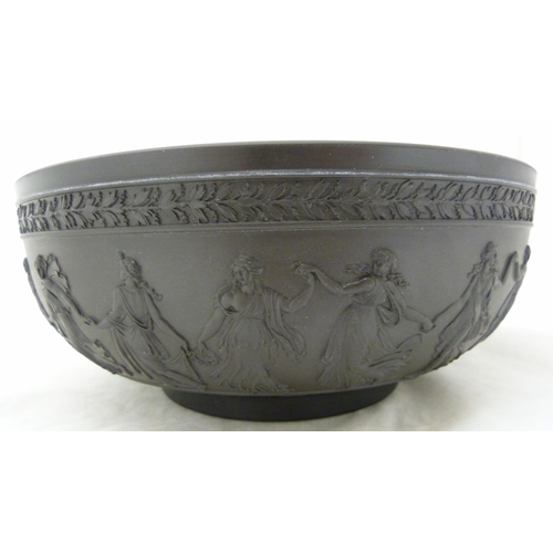 311 - Wedgwood black basalt fruit bowl with relief decoration of entwined classical figures and acanthus b... 