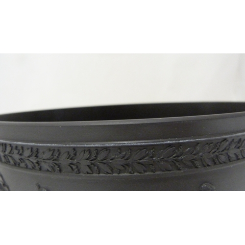 311 - Wedgwood black basalt fruit bowl with relief decoration of entwined classical figures and acanthus b... 