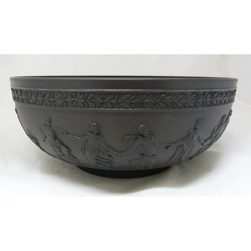 311 - Wedgwood black basalt fruit bowl with relief decoration of entwined classical figures and acanthus b... 