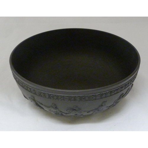 311 - Wedgwood black basalt fruit bowl with relief decoration of entwined classical figures and acanthus b... 