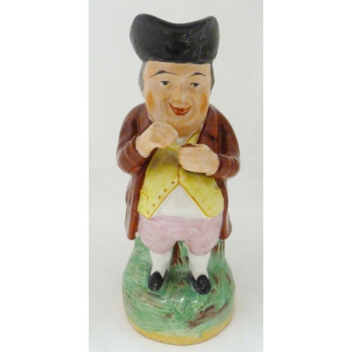 312 - Victorian Staffordshire pottery toby jug modelled as 'The Snuff Taker', in bright glazed colours, 26... 