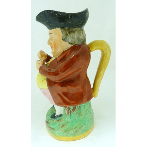 312 - Victorian Staffordshire pottery toby jug modelled as 'The Snuff Taker', in bright glazed colours, 26... 