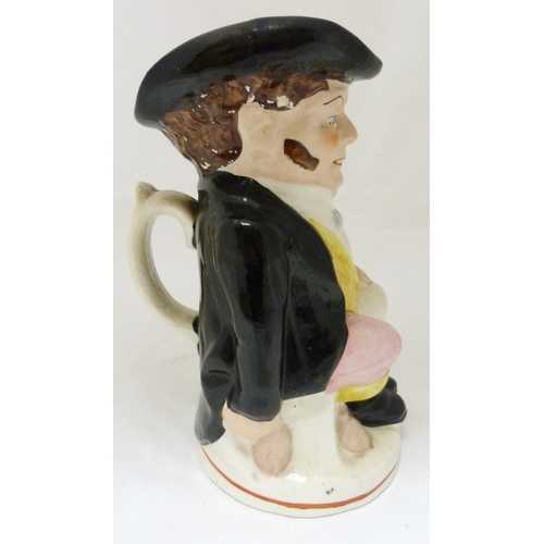 312 - Victorian Staffordshire pottery toby jug modelled as 'The Snuff Taker', in bright glazed colours, 26... 