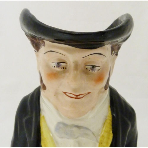 312 - Victorian Staffordshire pottery toby jug modelled as 'The Snuff Taker', in bright glazed colours, 26... 