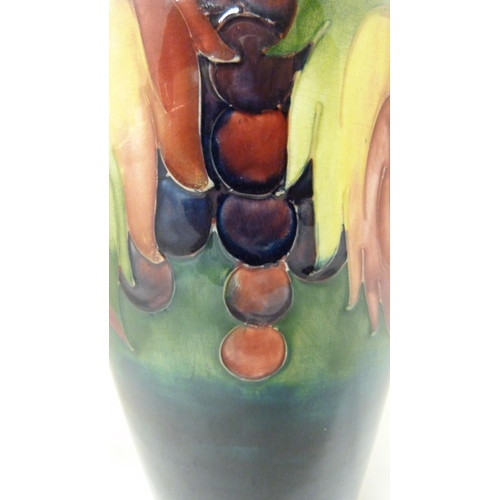 314 - William Moorcroft grape and leaf design tube-lined oviform vase, glazed in green and blue, stamped t... 