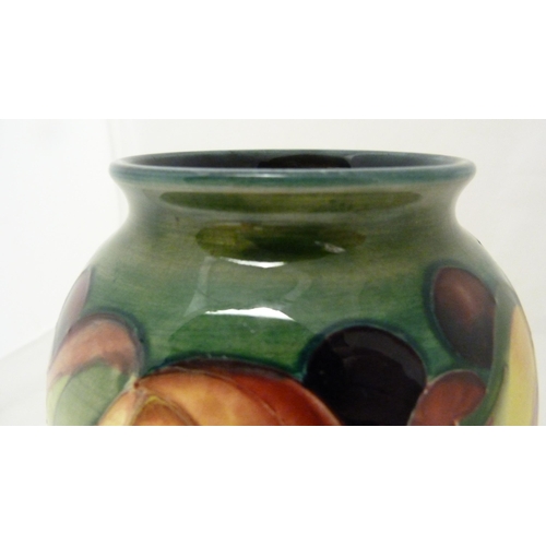 314 - William Moorcroft grape and leaf design tube-lined oviform vase, glazed in green and blue, stamped t... 