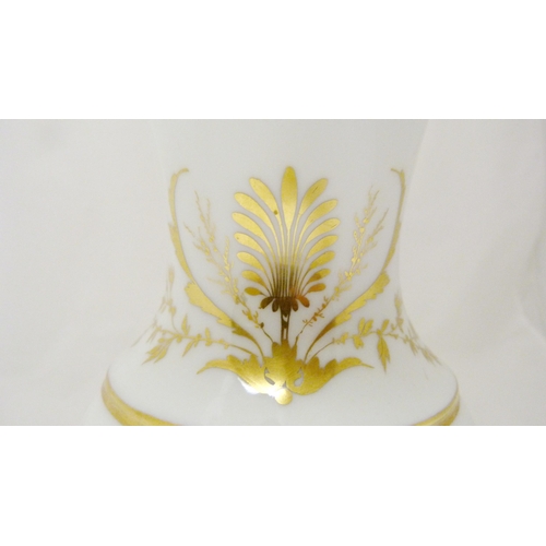 316 - Paris Porcelain ewer, c. 1790, of helmet form decorated with gilded foliage and borders on a white g... 