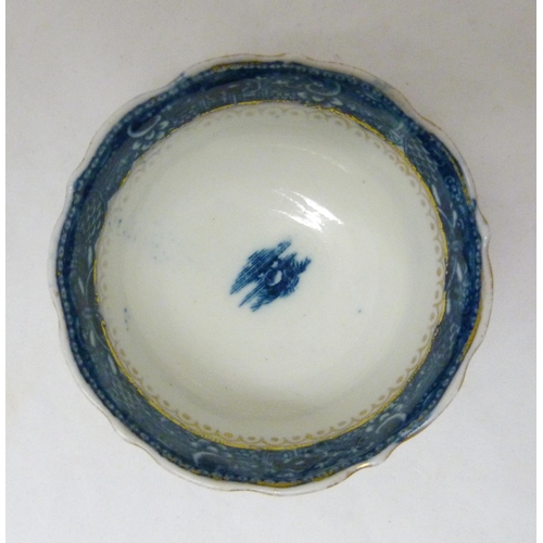 317 - Two 18th century Caughley blue and white porcelain tea bowls, both bearing Chinese garden patterns, ... 