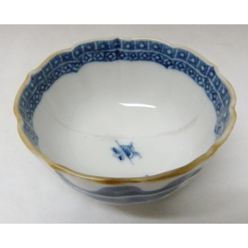 317 - Two 18th century Caughley blue and white porcelain tea bowls, both bearing Chinese garden patterns, ... 