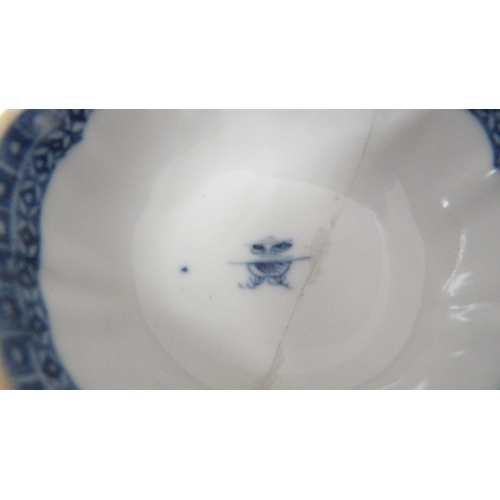 317 - Two 18th century Caughley blue and white porcelain tea bowls, both bearing Chinese garden patterns, ... 