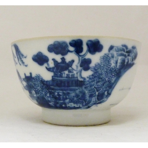 317 - Two 18th century Caughley blue and white porcelain tea bowls, both bearing Chinese garden patterns, ... 