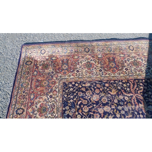 498 - Wilton-style carpet in the Islamic Garden design, with red and cream field on a blue ground, 367cm x... 