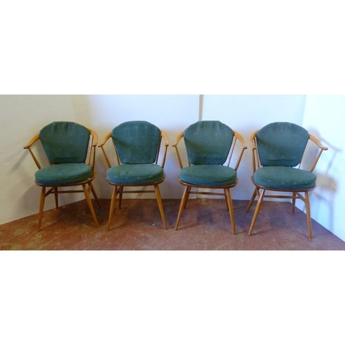 536 - Set of four mid-century Ercol elm and beech 'Cowhorn' chairs with stick backs, stamped to the unders... 