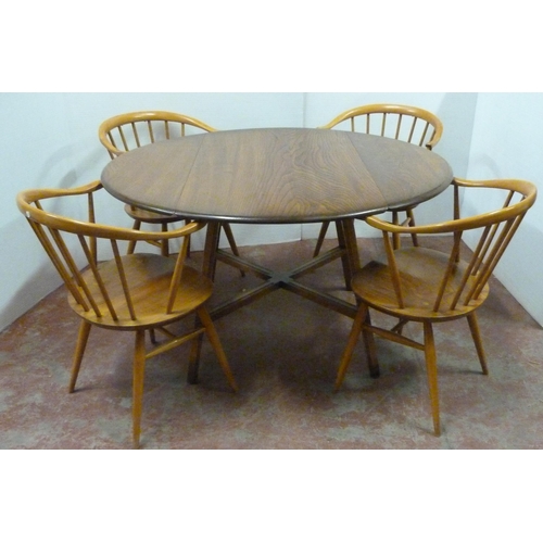 536 - Set of four mid-century Ercol elm and beech 'Cowhorn' chairs with stick backs, stamped to the unders... 