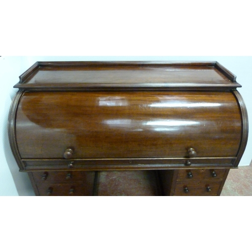 539 - Victorian mahogany cylinder desk, the fall front enclosing bird's eye maple-lined drawers and pigeon... 