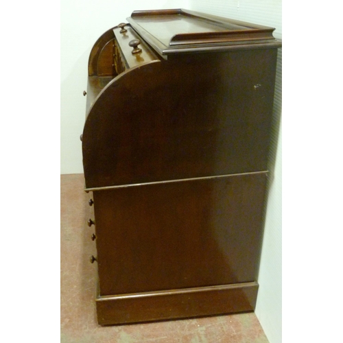 539 - Victorian mahogany cylinder desk, the fall front enclosing bird's eye maple-lined drawers and pigeon... 