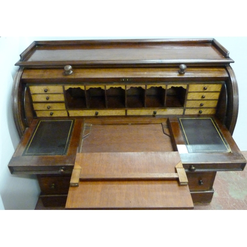 539 - Victorian mahogany cylinder desk, the fall front enclosing bird's eye maple-lined drawers and pigeon... 