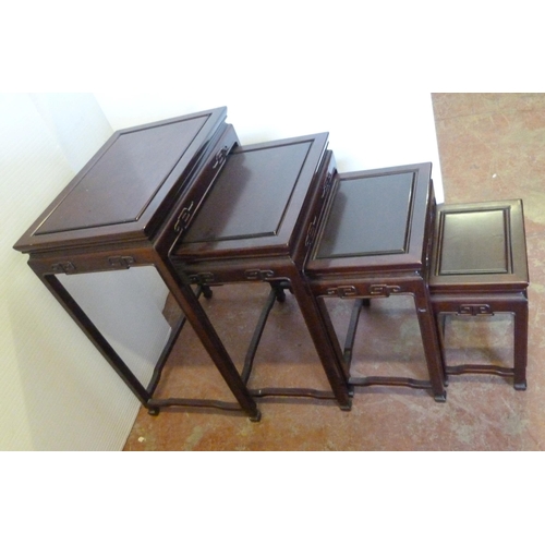 541 - Chinese-style quartetto nest of four graduated hardwood tables of reddish patina, the largest 66cm h... 