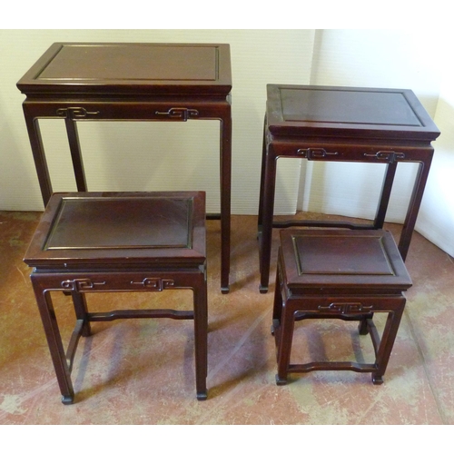 541 - Chinese-style quartetto nest of four graduated hardwood tables of reddish patina, the largest 66cm h... 