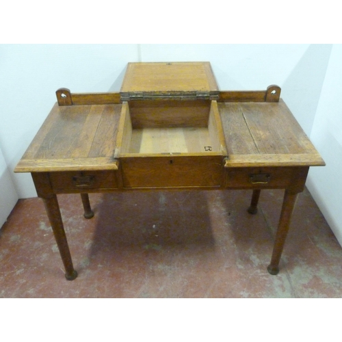 544 - Arts & Crafts oak writing desk, c. 1930s, with hinged writing flap to the top above two short dr... 