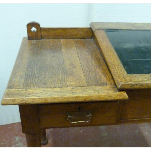 544 - Arts & Crafts oak writing desk, c. 1930s, with hinged writing flap to the top above two short dr... 