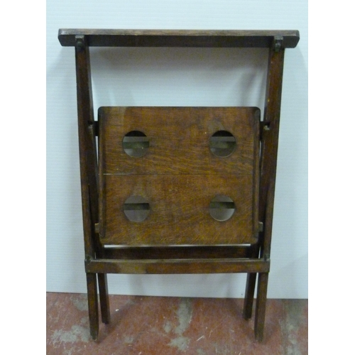 545 - Oak butler's table with fitted tray top above a shelf with four apertures, on folding supports, 76cm... 