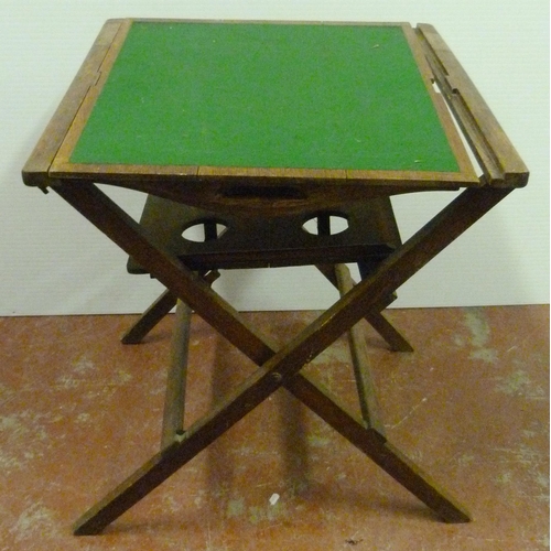 545 - Oak butler's table with fitted tray top above a shelf with four apertures, on folding supports, 76cm... 