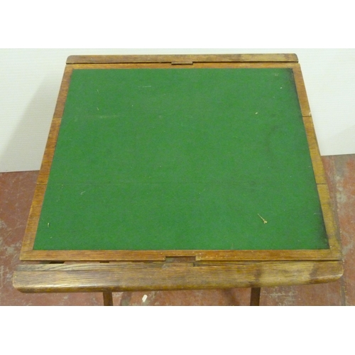 545 - Oak butler's table with fitted tray top above a shelf with four apertures, on folding supports, 76cm... 