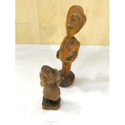 268 - Two carved Black Forest style figures, one in the form of a pipe.