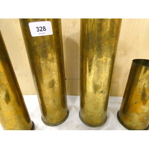 328 - Four antique brass trench art shells.