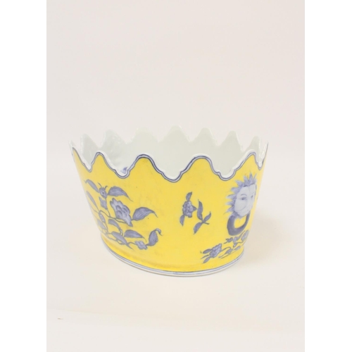 227 - Chinese style Monteith bowl on a yellow ground with blue foliage, and faux lion mask handles to each... 