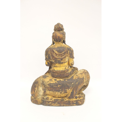 229 - Antique Chinese carved and painted wooden figure of Guanyin seated on an elephant, traces of gilt pa... 